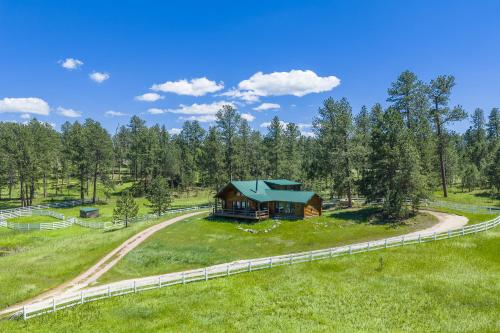 an aerial view of a cabin in the middle of a field at Whitetail Springs Ranch in Custer