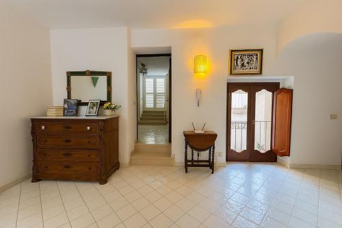 a room with a wooden dresser and a mirror at Dream View in Positano in Positano