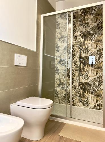 a bathroom with a toilet and a shower at Vera Hotel in Porto San Giorgio