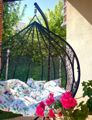 a wrought iron bed with pillows on a patio at Vivien Chalet in Victoria