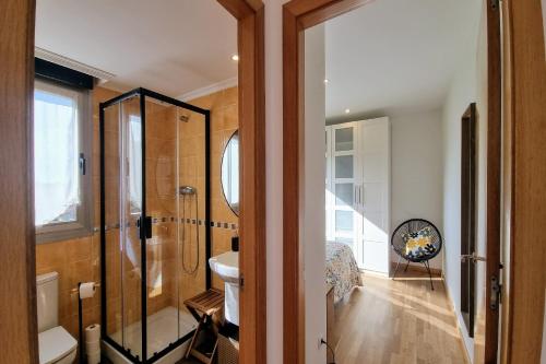 a bathroom with a shower and a sink at Apartamento Las Xanas in Llanes
