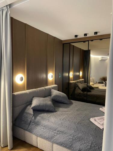a bedroom with a bed with two pillows on it at Premium Apartment with Terrace in Central Palanga in Palanga