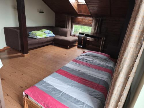 Ένα ή περισσότερα κρεβάτια σε δωμάτιο στο Vilnu Guest House