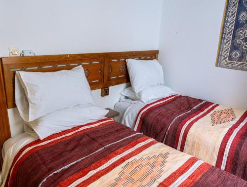 Tetouan house Dar Sultana High-end and beautiful in the center of Tetouanにあるベッド