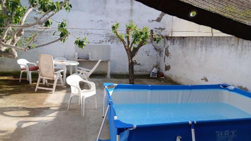 a pool in a yard with a table and chairs at Toledo Double Private Room in Toledo