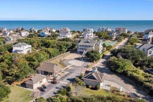 an aerial view of a neighborhood with houses and the ocean at Dream Inn in Corolla