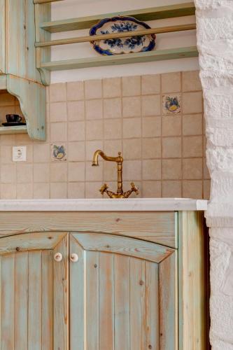 a bathroom with a sink and aaucet at Kois Loft in Ermoupoli