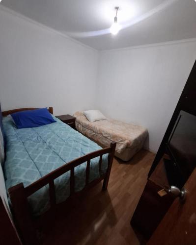 Ένα ή περισσότερα κρεβάτια σε δωμάτιο στο Hosteria