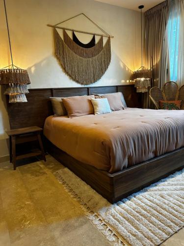 a bedroom with a large bed in a room at Villa with a private pool in Tulum
