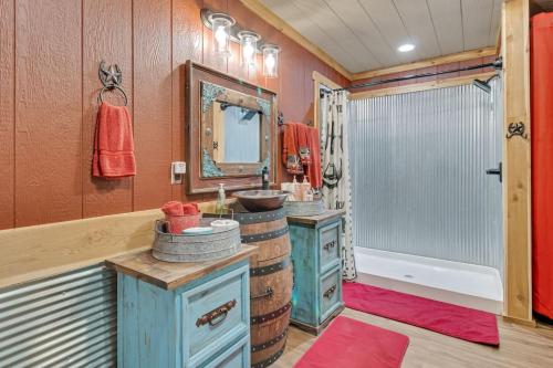a bathroom with two sinks and a mirror at Lakeside Retreat And Game Haven in Eufaula