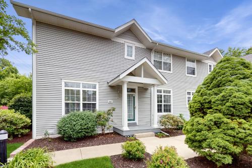 a white house with a landscaping at Beacon Court Condo F in Douglas