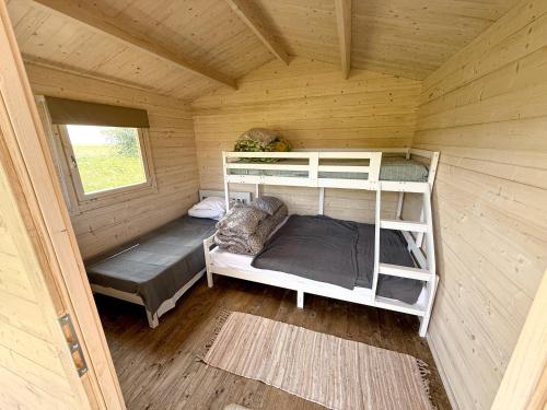 Postel nebo postele na pokoji v ubytování Seaside Retreat with Hot tub,Sauna, Pool & BBQ