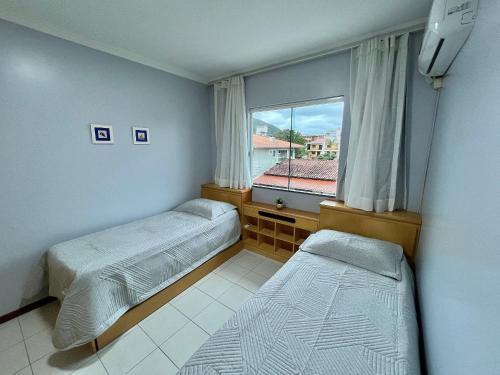 Postel nebo postele na pokoji v ubytování Res Palmeiras