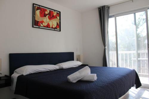 Postel nebo postele na pokoji v ubytování Jubilee Lofts by Quinta las Fuentes Peña de Bernal