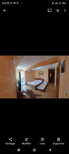 two pictures of a room with a bed in a room at Villa M in Dobra Voda