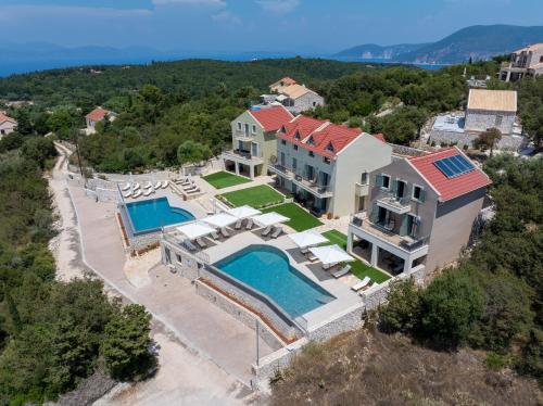 an aerial view of a house with a swimming pool at THISEFS luxury apartments Kefalonia in Antipata