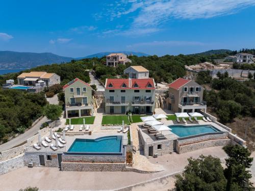 an aerial view of a mansion with a swimming pool at THISEFS luxury apartments Kefalonia in Antipata