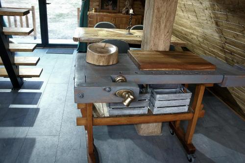 a wooden table with a sewing machine in a room at Villa India A-Frame in Ledenik
