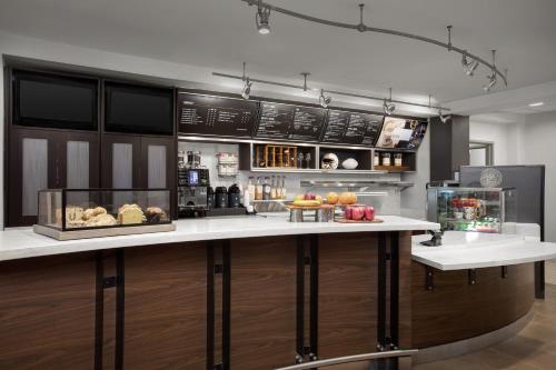 a kitchen with a counter with food on it at Courtyard by Marriott Colorado Springs South in Colorado Springs