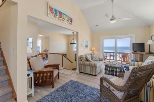 a living room with a view of the ocean at Everlasting Moon in Rodanthe