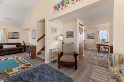 a living room with a couch and a chair at Everlasting Moon in Rodanthe