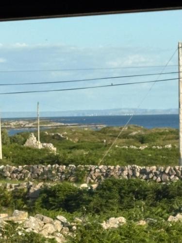 a view of the ocean from a train window at Tigh Oisin in Lettermullan