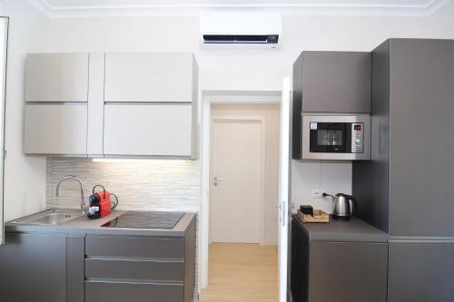 O bucătărie sau chicinetă la San Giovanni Suite Rome