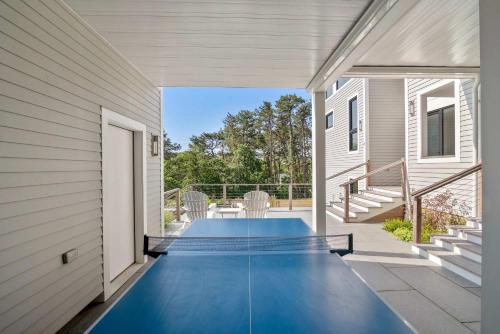 a swimming pool on the porch of a house at Coastal Luxury Near Wellfleets Best Beaches in Wellfleet