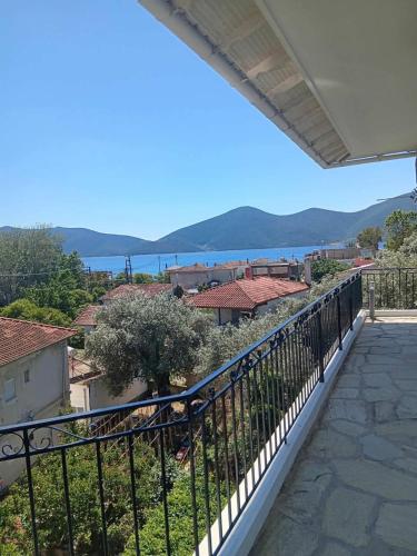 a balcony with a view of the water at galazio in Khorió Akhíllion