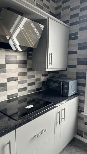 Kuchyň nebo kuchyňský kout v ubytování stay inn - shared flat in Portadown