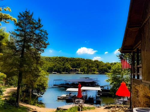 a view of a lake with a dock at Historic Lakefront Log Cabin4bd3badockfirepit in Camdenton
