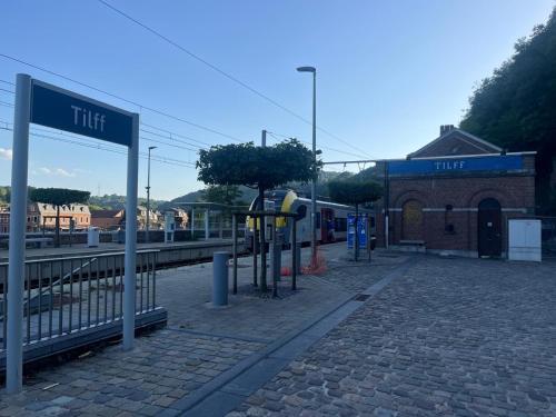 a train station with a sign that says flirt at Bel appart - Tilff in Tilff