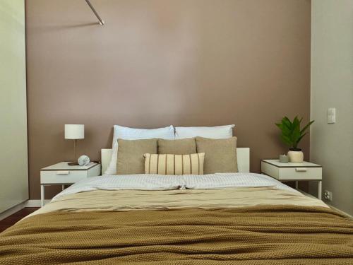 Ένα ή περισσότερα κρεβάτια σε δωμάτιο στο Goldis Centrum Apartments