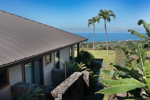 a house with a view of the ocean at Hale La'i in Kailua-Kona