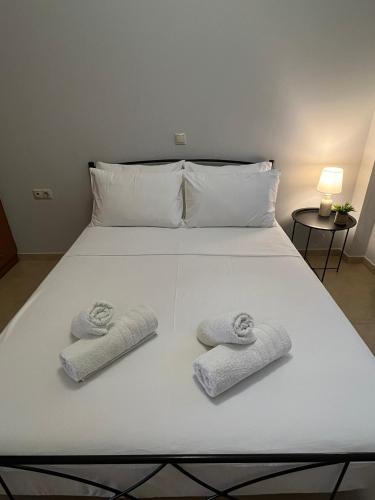 Postel nebo postele na pokoji v ubytování Bloom Garden Apartment