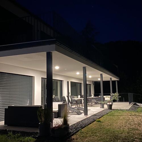 a house with a patio at night at Peter`s Lucky Home Balaton, Vonyarcvashegy in Vonyarcvashegy