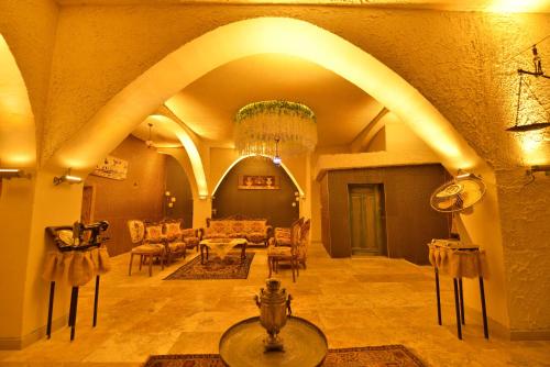 a large living room with a couch and chairs at Ashab-I Kehf Cappadocia House in Nevsehir