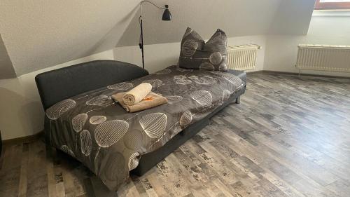 a bedroom with a bed with pillows on it at Wunderschöne großzügige Neustadtwohnung in Dresden
