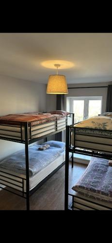 a room with two bunk beds and a table at The Temple Bar Guesthouse in Dublin