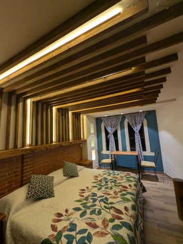 Una cama o camas en una habitación de Hotel Bello Amanecer