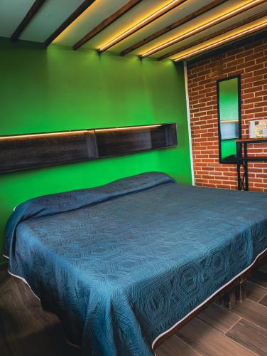 Una cama o camas en una habitación de Hotel Bello Amanecer
