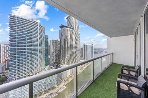 a balcony with chairs and a view of the city at Penthouse ICON W hotel WaterViews balcony Brickell in Miami