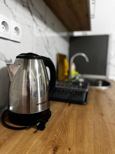 a toaster sitting on a counter in a kitchen at Apartman MERJEM in Konjic