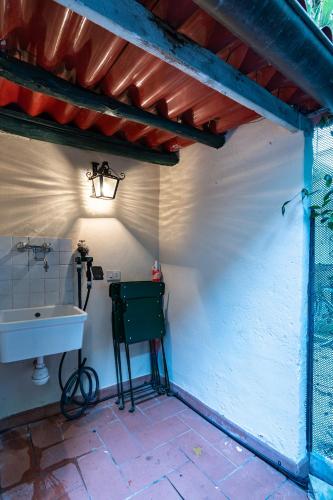 a small bathroom with a sink and a sink at Campucetto Rosso 5 Min from Duomo with Garden and AC in Florence