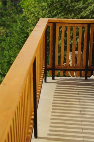 a wooden walkway with a rope attached to it at Hiška na skalci, The House on the Rock in Krka