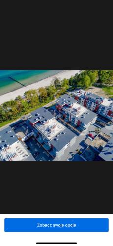 an overhead view of a shipyard with cars parked at Klifowa Apartament Premium in Rewal