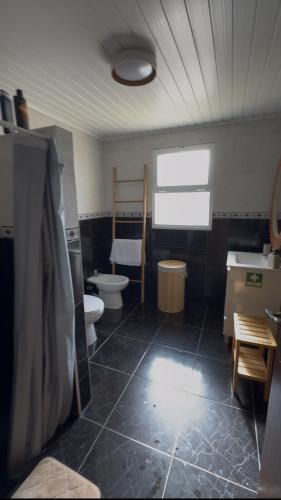 a bathroom with two toilets and a sink at Brisa do Nordeste in Nordestinho