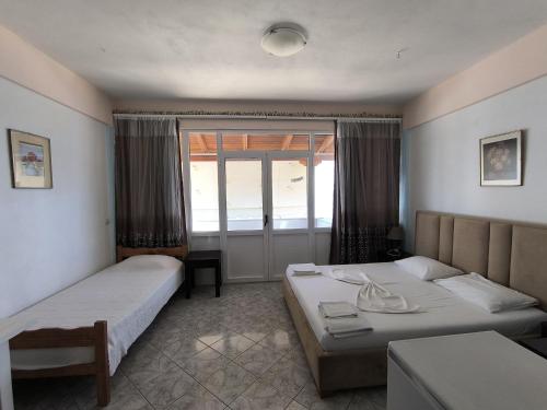 Postel nebo postele na pokoji v ubytování Q Bay Apartments