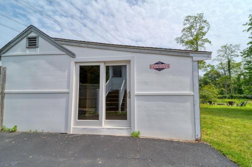 a white garage with a sign on it at 3 Bedroom Cape House by Leavetown Vacations in Sandwich