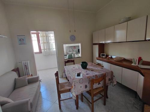a kitchen with a table and a dining room at CROTONE Mare&Confort in Crotone